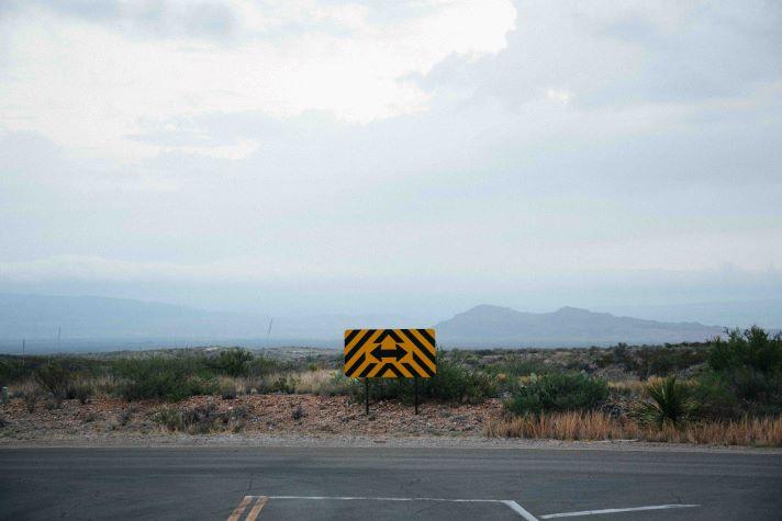 Mountain road with road sign